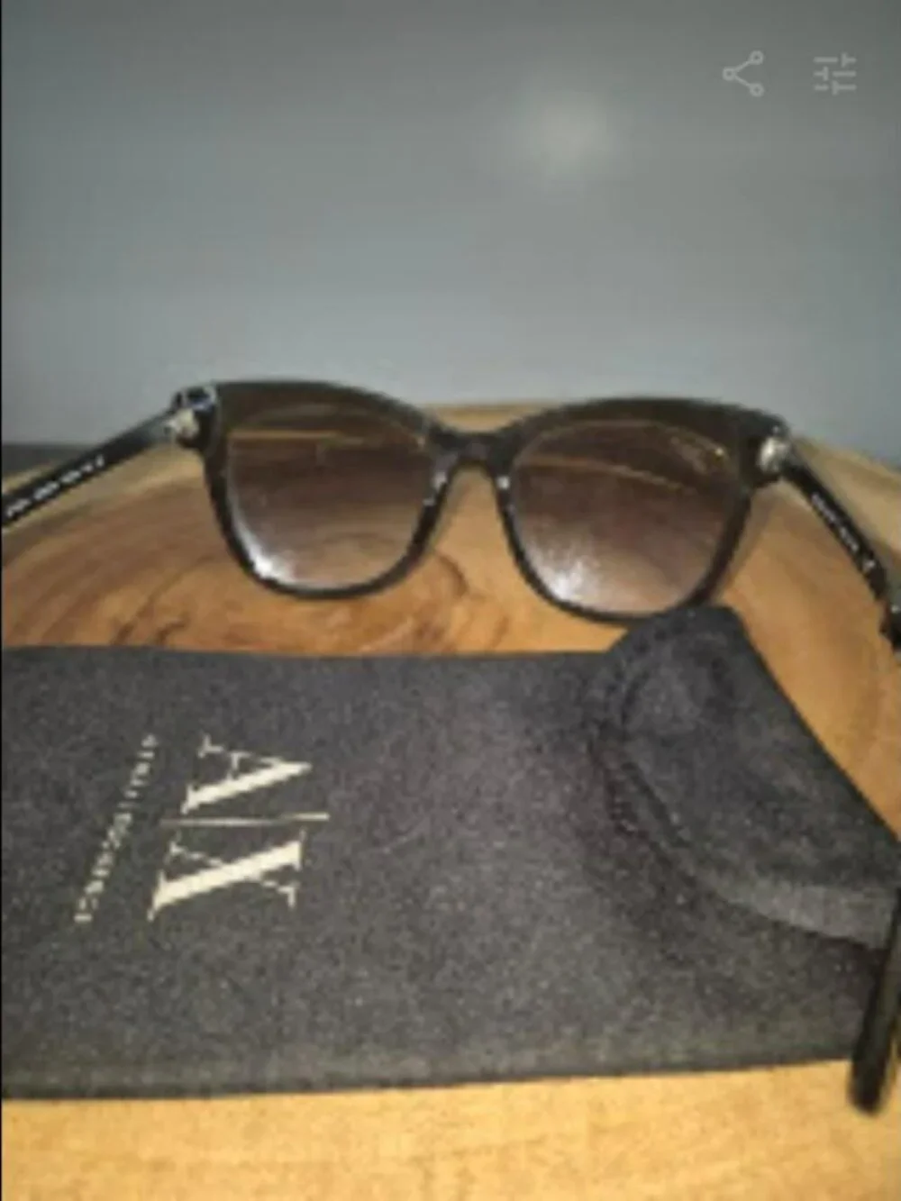 Giorgio Armani with A/X sunglass bag